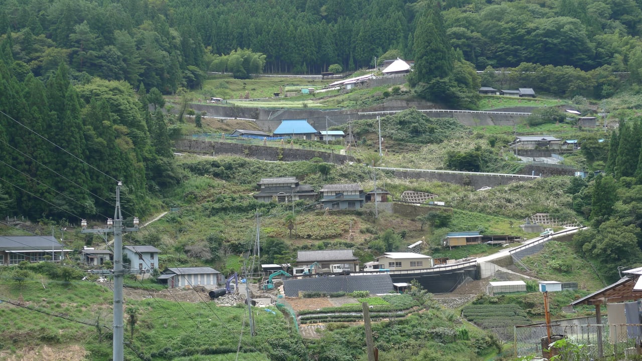 Traditional houses scattered across a steep terraced mountainside in Ochiai, a hamlet in the Iya Valley area of Miyoshi, Tokushima.