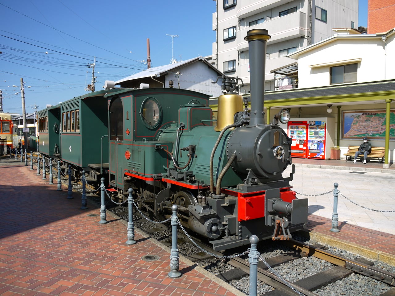 The Botchan Train steam locomotive replica stopped at Dogo Onsen Station plaza in Matsuyama.