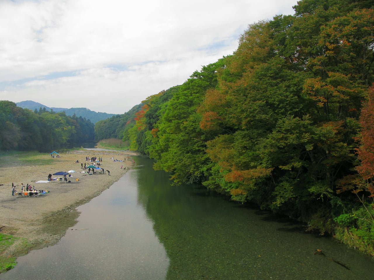 The wooded Ranzan valley seen from a bridge over the Tsukigawa River in Ranzan, Saitama.
