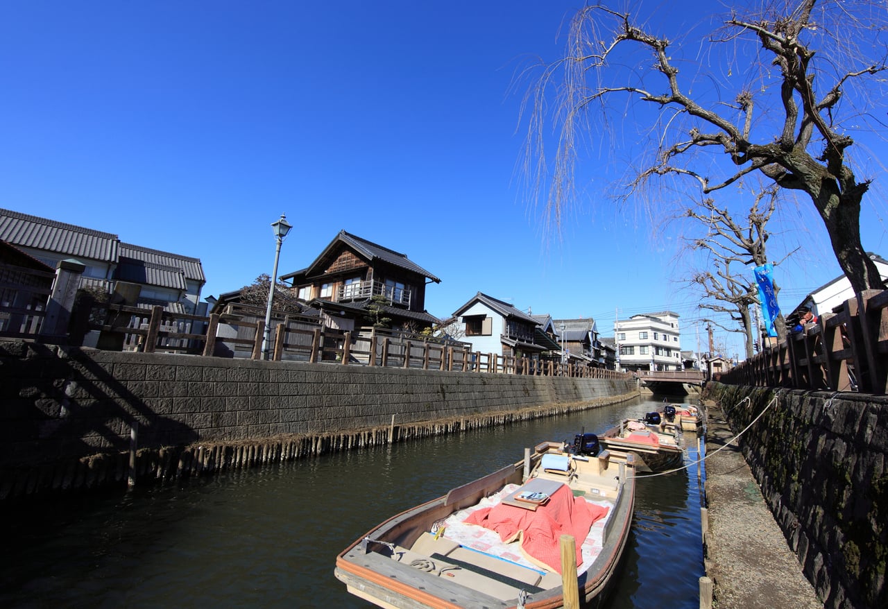 Traditional wooden merchant buildings line the Ono River canal in the old town of Sawara, Katori, Chiba Prefecture.